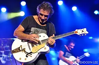 Moss performing with Cold Chisel in 2012