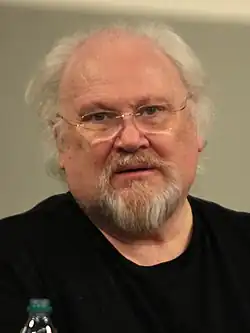 A headshot of Colin Baker