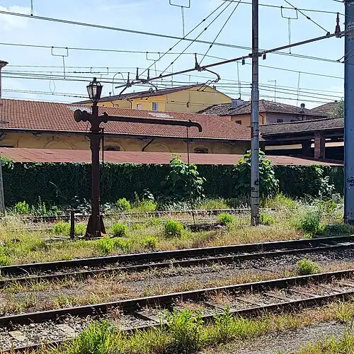 One of the two hydraulic columns between the third and fourth track.