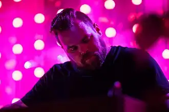 Com Truise performing in 2018