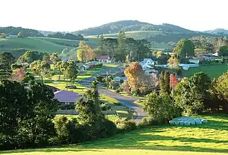 Comboyne is located on the Comboyne Plateau, an area of rolling hills characterised by red basalt soils and high rainfall.