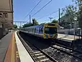 A Comeng train on a Craigieburn-bound service idles at Platform 2, November 2024