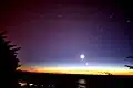 The tail of the comet Comet McNaught was still seen in the Northern Hemisphere after the comet itself was long gone. The picture also shows the Moon and Venus.