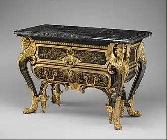 Commode; by André Charles Boulle; c. 1710–1732; walnut veneered with ebony and marquetry of engraved brass and tortoiseshell, gilt-bronze mounts, antique marble top; 87.6 x 128.3 x 62.9&nbsp;cm; Metropolitan Museum of Art[174]