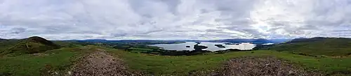 A panorama taken at the sub-summit of Conic Hill. Loch Lomond can be seen in the center of the image.