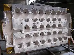 Molten aluminum pours into this casting die (top view of die)