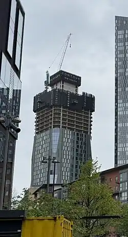 Tower 1 under construction in April 2025