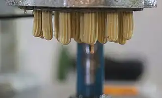 Iranian bamiyeh being made