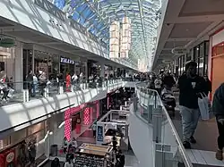 The concourse of a two-story shopping mall