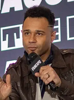 A photo of Corbin Bleu speaking at a Q&A panel during MEGACON Orlando on February 6, 2025.