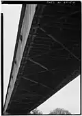 (image 7 of 9) 1984 Underside showing – from the bottom up – the lower lateral braces attached to the floor joists that support the floor planks.