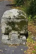 Carved stone in front of a house