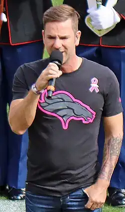 Campbell singing "The Star-Spangled Banner" before a Denver Broncos home game against the Atlanta Falcons on October 9, 2016