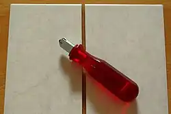 Simple glass cutter used to cut ceramic tile