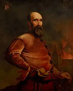 Black-and-white depiction of a man seated on a chair, with a large smouldering crown on his head. He is naked, his crotch covered with a cloth, and his hands are tied behind his hack. Two people are tearing at the flesh of his shoulders with their mouths, ne of them restrained from behind. A man is playing a pipe. The scene is crowded and set in no particular background. At least four people are seen impaled around.