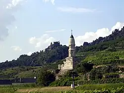 A monument stands at the edge of a cliff.