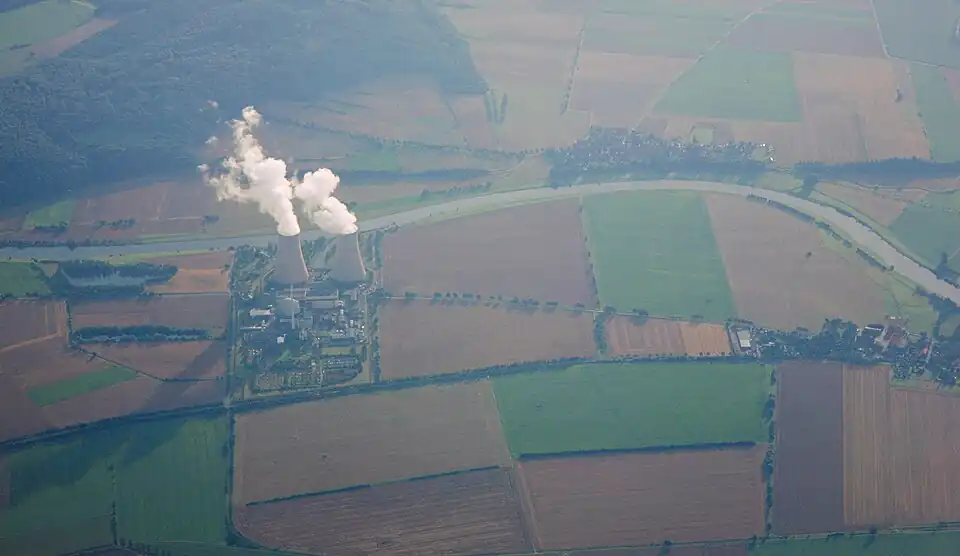 Aerial view of Grohnde nuclear power plant on the Weser river, the village of Grohnde is visible to the right.