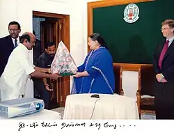 Jayakumar greets Chief Minister Jayalalithaa alongside Microsoft Chairman Bill Gates in December 2005