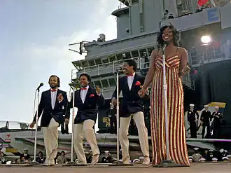 Gladys Knight & the Pips perform aboard aircraft carrier USS Ranger on November 1, 1981. Left to right: William Guest, Edward Patten, Merald "Bubba" Knight, and Gladys Knight.