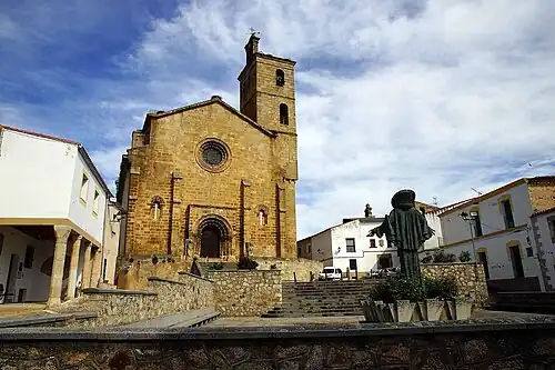 View from the plaza, facing west. A statue of Saint Peter of Alcántara in the foreground.