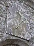 Sundial over doorway of the porch