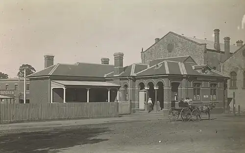 A view of the Dandenong Post Office at the start of the 20th century (now demolished). The back of the town hall on the right.