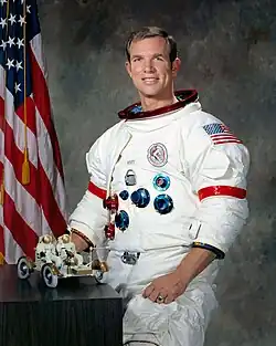 Scott posing with a model of the lunar roving vehicle