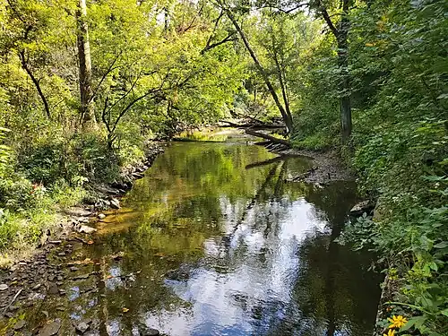 Looking upstream (south) from train track tressle in Deep River County Park