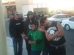 The band (with a fan in front in the green shirt)