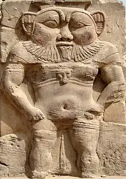 Relief of Bes in the Hathor Temple courtyard.