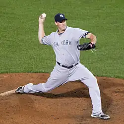 Derek Lowe pitching in a gray New York Yankees uniform