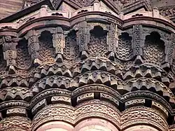 Muqarnas corbelling around the balcony of the Qutb Minar in Delhi (1199–1220, Delhi Sultanate)