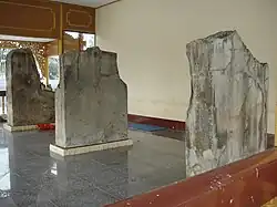 A man-sized chunk of stone in a room