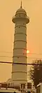 Twilight sun peeking through the window of the iconic Dharahara