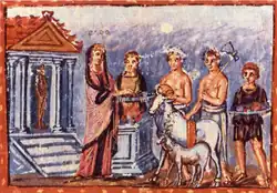 Early medieval manuscript: Dido wears a crown and covers her head with a cloak; two sacrificial animals and various attendants stand with her around an altar.