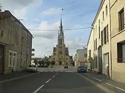 The church and surroundings in Douzy