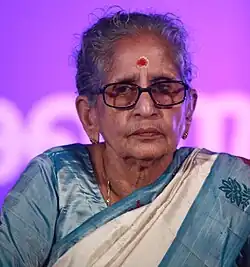A photograph of a woman with spectacles