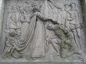Drake receives knighthood from Queen Elizabeth. Bronze plaque by Joseph Boehm, 1883, base of Drake statue, Tavistock