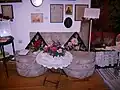 The small sofa on which he used to sit with Kate Manou, his last muse (‘Folk’ Hall).