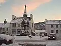 The Cross, looking south, with the Dunkeld Detachment of the Black Watch drill hall behind it