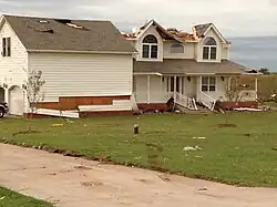 EF1 damage example--There is damage to mobile homes and other temporary structures becomes significant, and cars and other vehicles can be pushed off the road or flipped. Permanent structures can suffer major damage to their roofs.