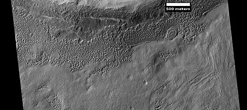 Small, layered structure, as seen by HiRISE under the HiWish program Picture also shows brain terrain forming.