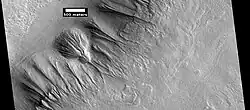 Gullies along mesa wall in North Tempe Terra, as seen by HiRISE under HiWish program