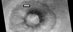 Pedestal crater with boulders along rim. Such craters are called "halo craters."[121] Picture taken with HiRISE under HiWish program.