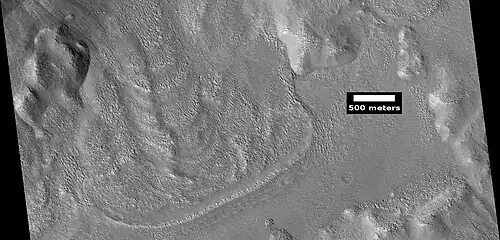 Glacier coming out of valley, as seen by HiRISE under HiWish program Location is rim of Moreux Crater. Location is Ismenius Lacus quadrangle.