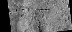Hanging valley, as seen by HiRISE under HiWish program This may have been a waterfall at one time.