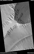 Wide view of layers in the Louros Valles, as seen by HiRISE under HiWish program. The Louros Valles are part of Ius Chasma.