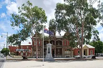 Town hall, now a cinema, with the war memorial in the foreground