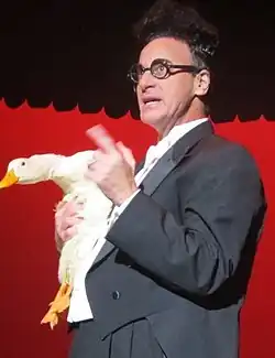 Ed Alonzo holding Bob the Duck while performing at Kings Island