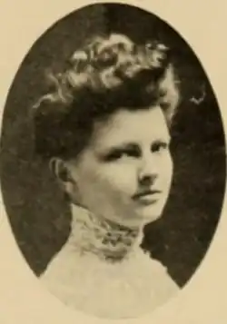 A young white woman with hair in an updo, in an oval frame